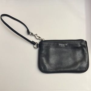 Coach: Black Leather Zip Wristlet with 2 card slots.